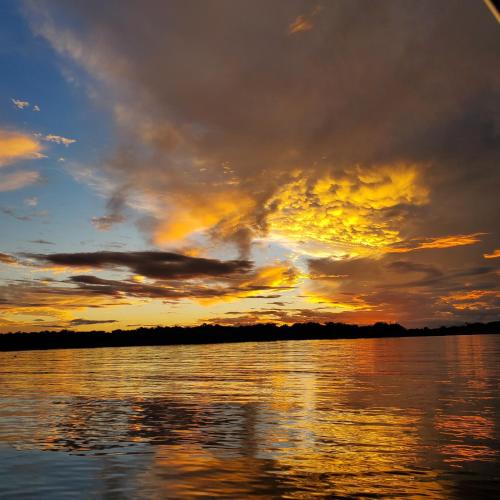 a sunset over a body of water at Lakeview Inn & Suites Okeechobee in Okeechobee
