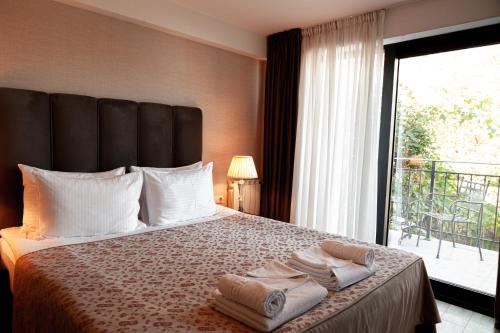 Postel nebo postele na pokoji v ubytování Hotel Winoterra