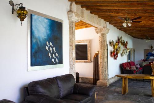 a living room with a couch and a table at Finca del Rocio in Parras de la Fuente