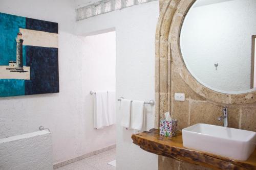 a bathroom with a sink and a mirror at Finca del Rocio in Parras de la Fuente