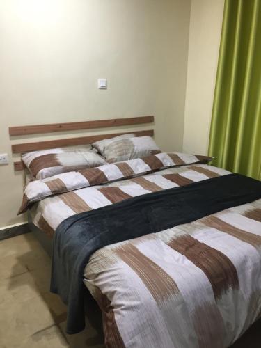 Ένα ή περισσότερα κρεβάτια σε δωμάτιο στο Bubbles Lodge Kinangop