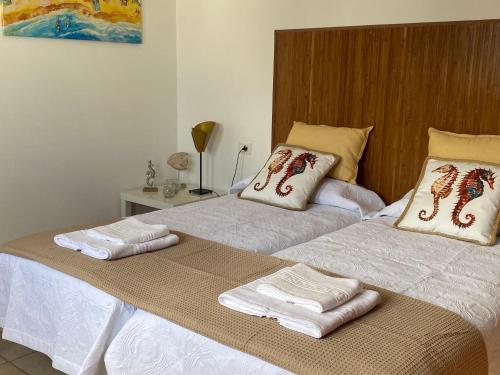 Postel nebo postele na pokoji v ubytování CALIMA Holiday House