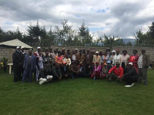 a group of people posing for a picture on the grass at Bubbles Lodge Kinangop in South Kinangop