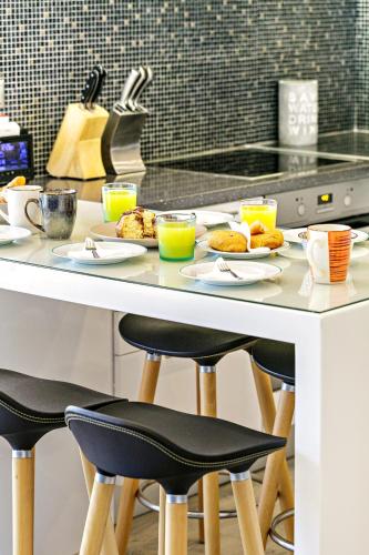 a breakfast table with plates of food on it at Filia Stone Villa in Gouvia