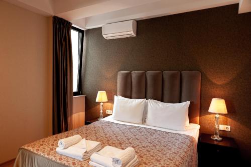 Hotel Winoterra tesisinde bir odada yatak veya yataklar