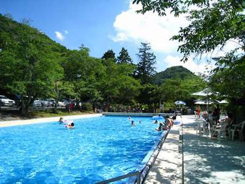 a group of people in a swimming pool at Nanten-En in Kawachinagano