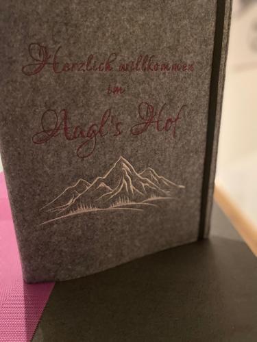 a book with a picture of a mountain at Augl‘s Hof in Ischgl