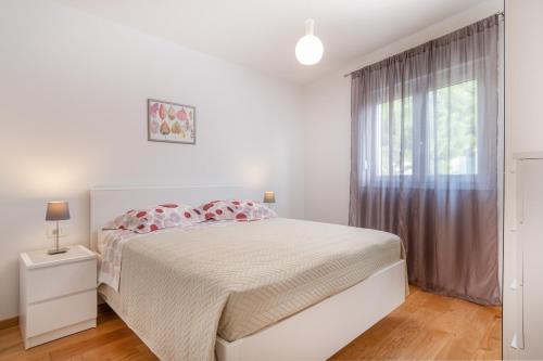 Postel nebo postele na pokoji v ubytování SOLU Apartment