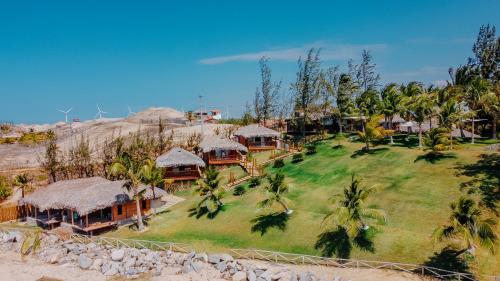 an aerial view of a resort on the beach at Collina Beach in Amontada
