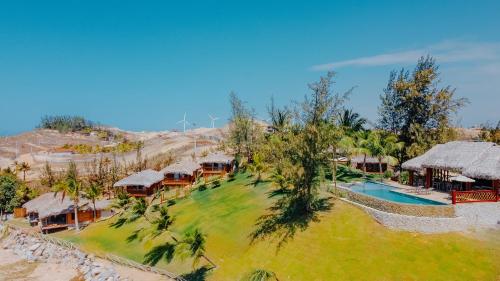 an aerial view of a resort with a swimming pool at Collina Beach in Amontada