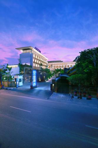 an empty street in front of a large building at Aston Bojonegoro City Hotel in Bojonegoro