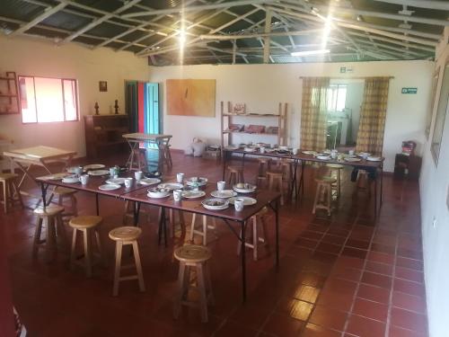 an overhead view of a room with tables and stools at Nuestro Bosque I in Tena