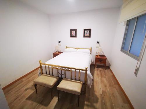 Postelja oz. postelje v sobi nastanitve La Quinta De Santillan