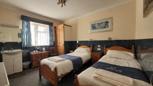 Postel nebo postele na pokoji v ubytování Argyle Lodge Self Catering Guest House