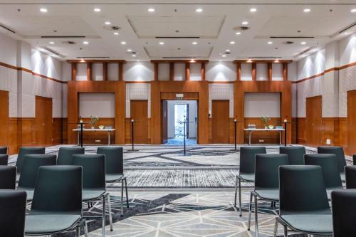 a large room with chairs and tables in it at Radisson Blu Hotel, Antwerp City Centre in Antwerp