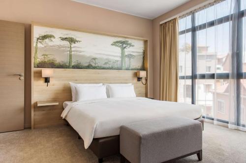Postel nebo postele na pokoji v ubytování Radisson Serviced Apartments Antananarivo City Centre