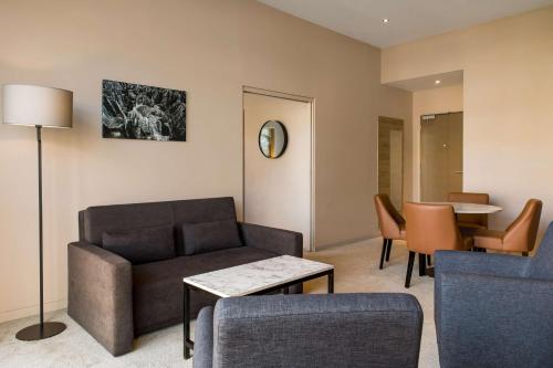 a living room with a couch and a table at Radisson Serviced Apartments Antananarivo City Centre in Antananarivo
