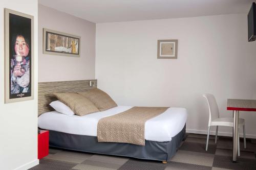 Katil atau katil-katil dalam bilik di Sure Hotel by Best Western Nantes Saint-Herblain