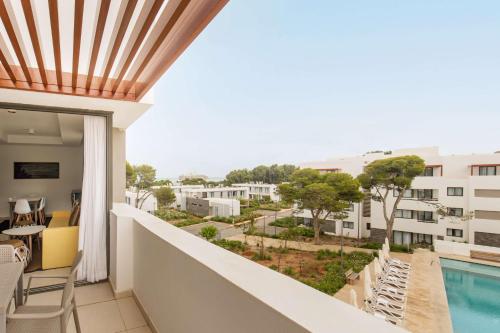 a balcony with a view of a pool and buildings at Radisson Blu Residences Al Hoceima in Al Hoceïma