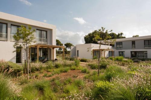 a house with a garden in front of it at Radisson Blu Residences Al Hoceima in Al Hoceïma