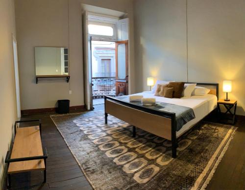 Säng eller sängar i ett rum på Iturbide500 hostal