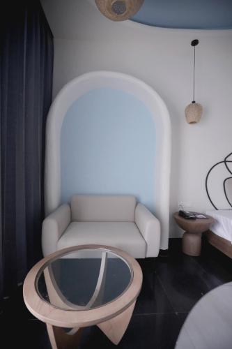 a living room with a couch and a coffee table at Ramee Royal Resort & Spa - Udaipur in Udaipur
