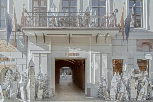a building with a balcony on top of it at Hotel Pacai, Vilnius, a Member of Design Hotels in Vilnius