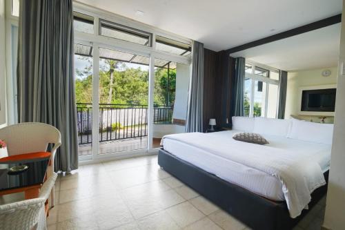 Ένα ή περισσότερα κρεβάτια σε δωμάτιο στο Sunvalley Homestay