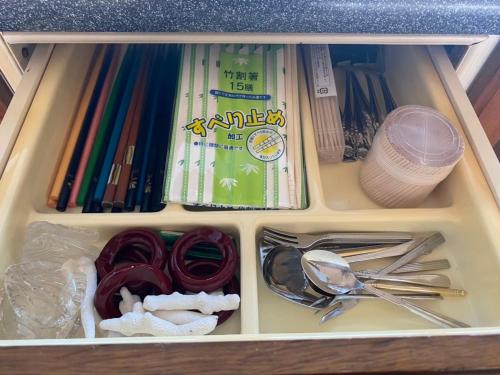 a lunch box with scissors and other utensils at Villa CocoNatu - KOHAMA - in Kohama