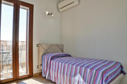 Posteľ alebo postele v izbe v ubytovaní Terrazza della Rocca (by Vacation Service)