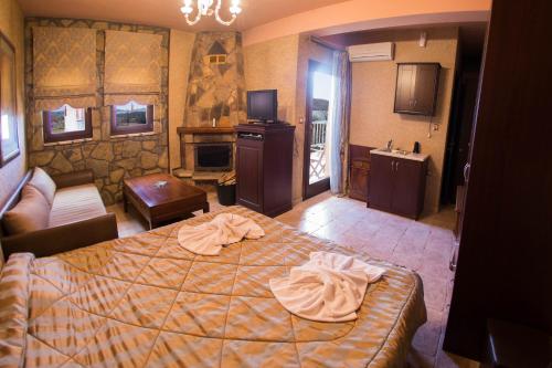 Postel nebo postele na pokoji v ubytování Silva Suites