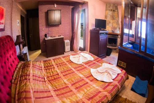 Postel nebo postele na pokoji v ubytování Silva Suites