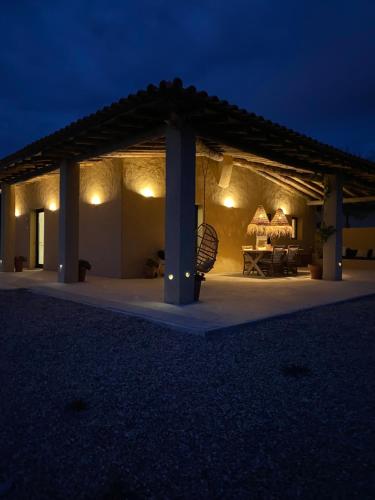 a pavilion at night with lights on it at Monte da Aparica in Galeguinha Grande