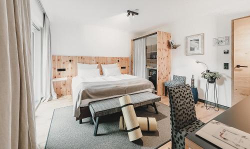 Postel nebo postele na pokoji v ubytování Hotel & Appartements Tiroler Buam