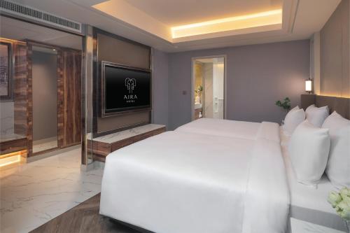 TV a/nebo společenská místnost v ubytování Aira Hotel Bangkok Sukhumvit 11