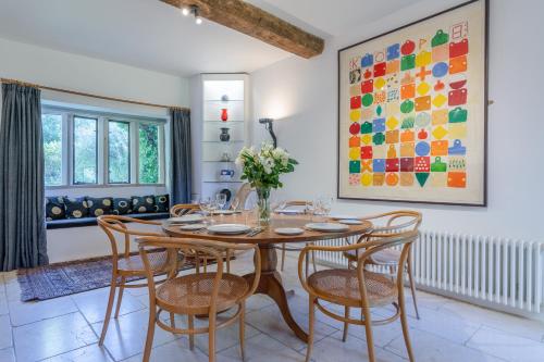 a dining room with a table and chairs at The Barracks in Northleach