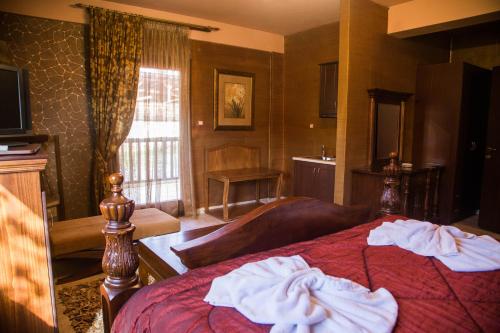 Postel nebo postele na pokoji v ubytování Silva Suites