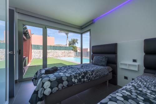 Postel nebo postele na pokoji v ubytování Villa Paradise