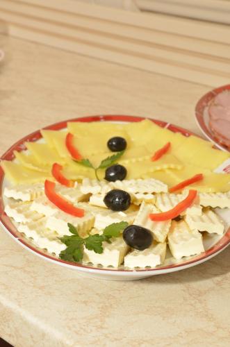 a plate of food with vegetables on a table at Hotel Orient Galati in Galaţi