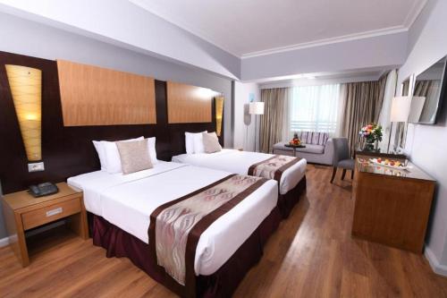 Postel nebo postele na pokoji v ubytování Tolip El Galaa Hotel Cairo