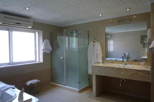 a bathroom with a shower and a sink at Hotel Paraíso Del Mar in Nerja