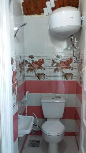 a bathroom with a toilet and a sink at Roma House in Aswan