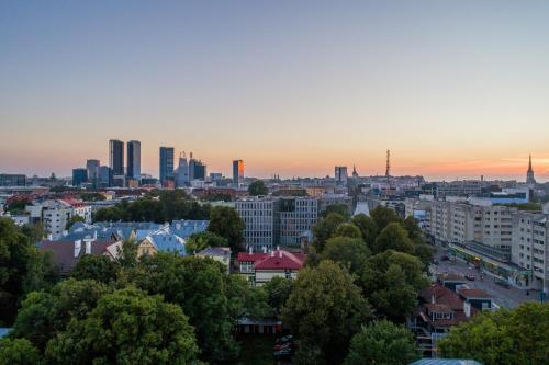 a cityscape of a city with buildings and trees at Bob W Avangard in Tallinn