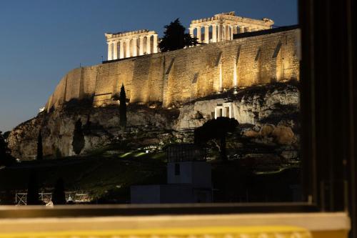 a view of the acropolis from a window at AthensWas Design Hotel in Athens