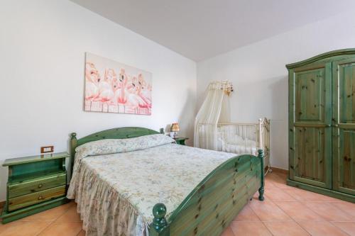Ένα ή περισσότερα κρεβάτια σε δωμάτιο στο Villa Verde Castiadas