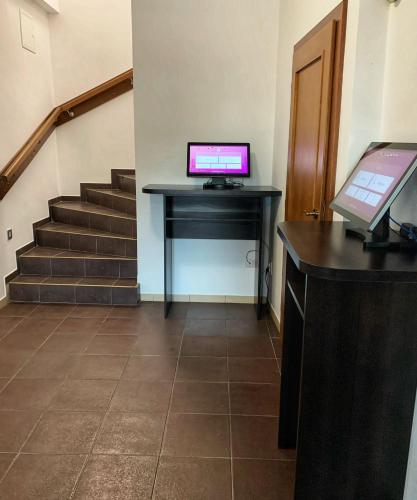 an office with a desk with a computer on it at Penzion U Broucka in Milevsko
