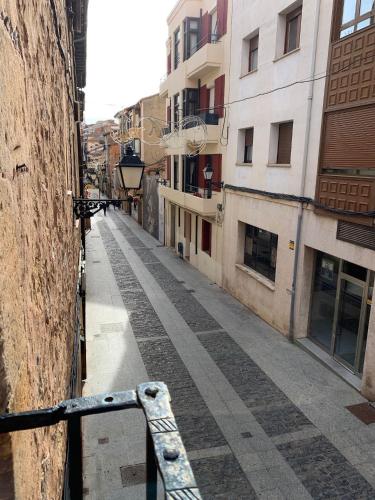 an empty street in a city with buildings at Vivienda turística La Caldera in Soria