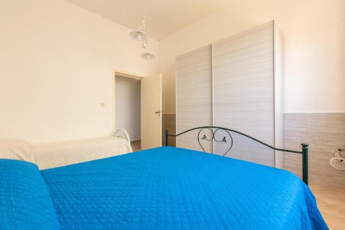 Ένα ή περισσότερα κρεβάτια σε δωμάτιο στο Villino La Caletta by BarbarHouse