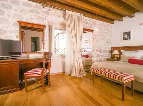 Posteľ alebo postele v izbe v ubytovaní Judita Palace Heritage Hotel