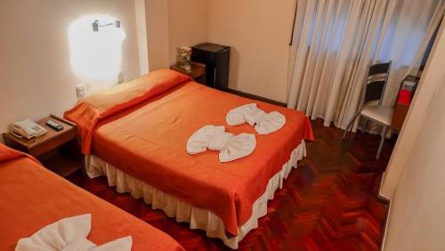 Ένα ή περισσότερα κρεβάτια σε δωμάτιο στο Crystal Hotel